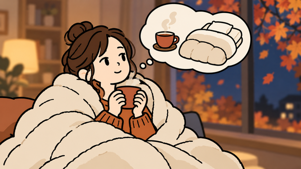 秋の夜、毛布にくるまって温かい飲み物を手にひと息つく女性のイラスト